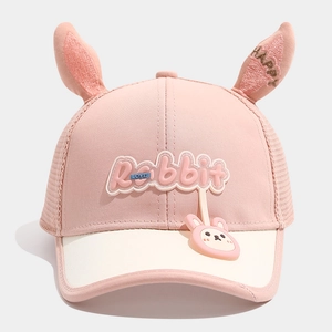 Detail of pink toddler mesh cap featuring 3D rabbit ears and cute cartoon pendant