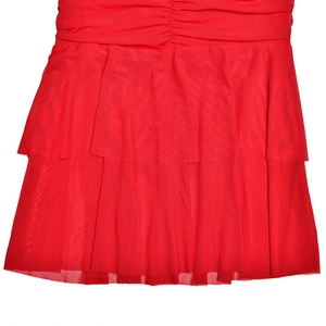 Detail of red mesh dress showing multi-layer ruffles and pleated waist textures