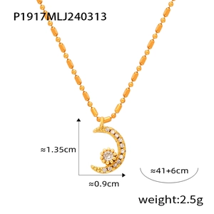 Detail view of gold moon and star pendant with beads chain including product dimensions