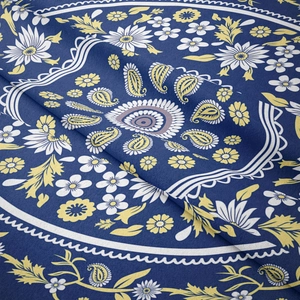 Close-up of navy blue paisley floral tapestry fabric with bohemia weave texture