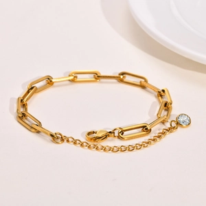 Gold stainless steel paperclip chain bracelet with lobster clasp and zircon drop detail