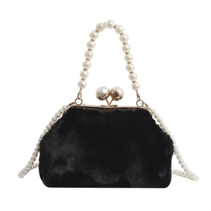 Chic black faux fur evening bag with pearl handle and golden clasp on white background