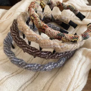 Set of four knitted wavy headbands in vintage brown and blue colors with non-slip design