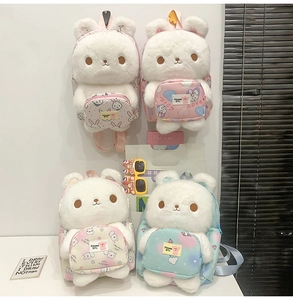 Detail view of plush bunny backpacks in white faux fur with colorful cartoon pattern pockets