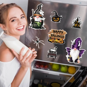 Halloween gnome magnets shown on refrigerator door with festive pumpkin and skull patterns