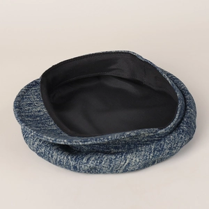 Blue and white tweed denim newsboy cap with stylish flat top and black lining