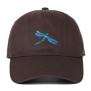 Detailed embroidery of a blue and green dragonfly on a dark brown cotton baseball cap