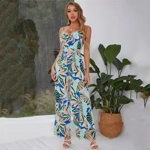 Close-up of tropical leaf print and lightweight woven fabric on a cami jumpsuit