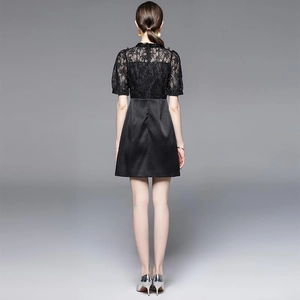 Elegant black high-waisted dress with lace patchwork and short sleeves, rear view