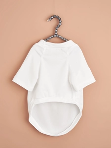 Detail of white mesh pet T-shirt featuring breathable fabric and a curved hem design