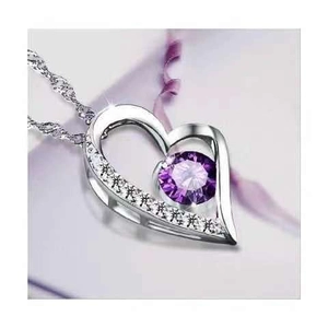 Macro view of S925 silver heart necklace featuring a suspended purple zircon stone