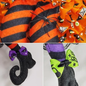 Detail of Halloween witch legs with orange striped fabric and black glitter shoes