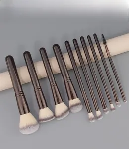 Close-up of 10-piece professional makeup brush set with gradient purple fiber bristles