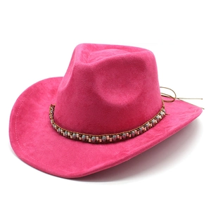 Detail of rose pink suede cowboy hat with ethnic braided bead band and wide brim