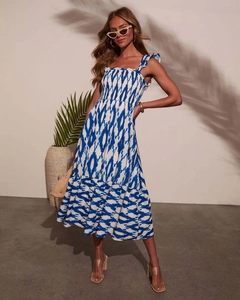 Detail of floral printed maxi dress featuring smocked elastic bodice and ruffled straps
