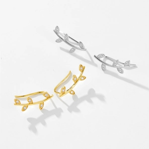 Close-up of S925 sterling silver leaf studs with sparkling white zircon stones