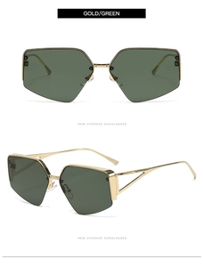 Detail of half-frame geometric sunglasses with gold metal frame and dark green lenses