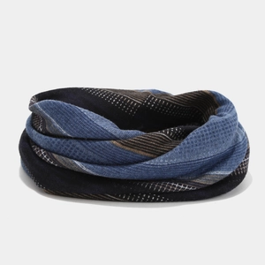 Detailed close-up of multi-color knitted infinity scarf with textured stripe pattern