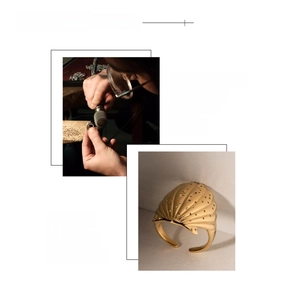 Detailed macro view of 18K gold plated shell ring with handcrafted textures and engraving