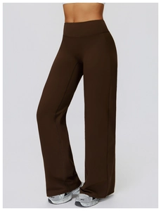 Detail view of high-waisted dark brown flared yoga pants showing elastic slimming fabric