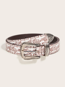 Detail of western style belt featuring silver floral buckle and butterfly printed pattern