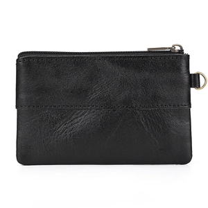 Close-up of black crazy horse leather coin purse with metal zipper and D-ring hook
