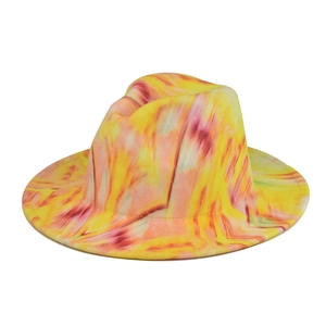 Close-up of vibrant yellow and red tie-dye felt fedora hat with a classic pinched crown