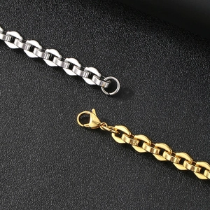 Polished gold and silver interlocking link bracelets on black textured leather