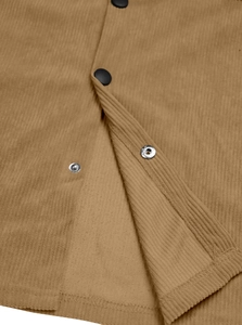 Close-up of caramel corduroy fabric texture and black metal snap buttons on the jacket
