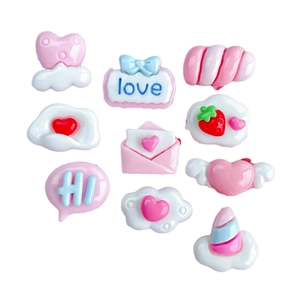 Pink and white resin charms set with heart, cloud, and bow shapes for DIY nail art and crafts