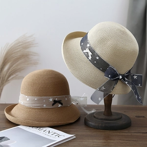 Women's straw sun hats with star ribbons and bows, beige and brown summer beach accessories