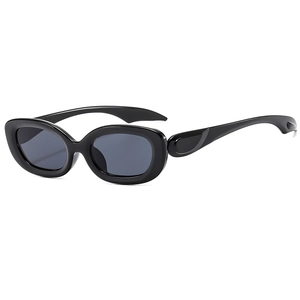 Retro Y2K oval cat-eye sunglasses with glossy black wide frame and dark grey lenses