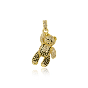 Macro shot of hip hop panda pendant with black and white crystals on golden base
