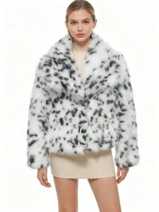 Detail shot of leopard print faux fur coat showing soft texture and high-quality leopard pattern