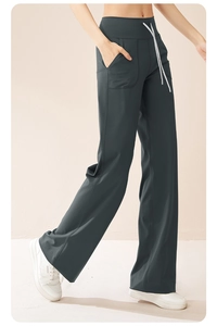 Detail of high waist wide leg yoga pants with white drawstring and side pockets