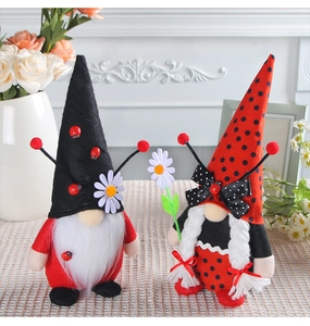 Detail of ladybug themed gnomes with polka dot hats and floral accents for home decor