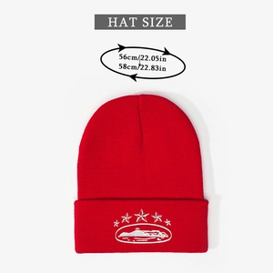 Detail showing red knitted beanie with white five-star embroidery and size specifications