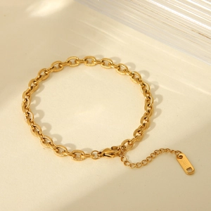 Detail of 18K gold plated stainless steel textured link bracelet with lobster clasp closure