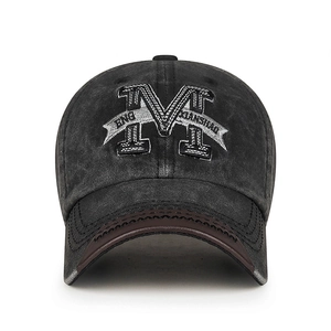 Vintage washed charcoal baseball cap with 3D M embroidery and brown leather brim accent