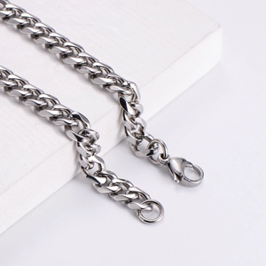 Polished silver stainless steel 7mm Cuban chain bracelet with secure lobster clasp for men