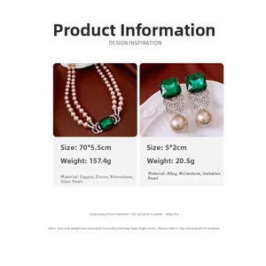 Close-up of vintage pearl jewelry set with emerald green stone and crystal details