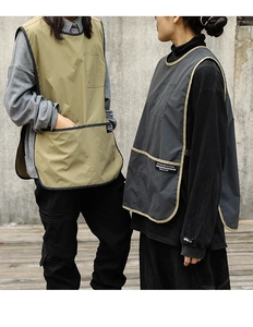 Detail of khaki and dark grey water-resistant aprons with multiple functional pockets