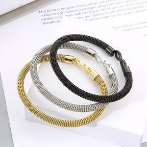 Detailed shot of stainless steel cable bracelets in gold, silver and black with infinity clasp