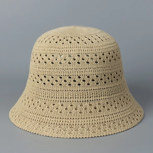 Detailed view of lightweight hollow knit texture on a beige summer bucket sun hat