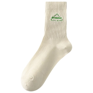 Off-white cotton crew socks featuring green dreamer letter embroidery and mountain logo