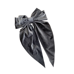Dark grey velvet bow hair clip with long ribbons shown on a clean white background