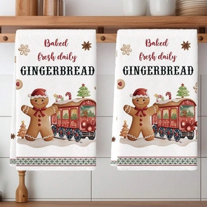 Christmas kitchen towels with gingerbread man and train prints hanging in kitchen