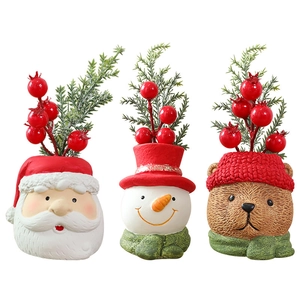 Christmas snowman and Santa resin ornaments with faux pine and berries for decor