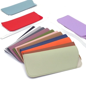 Detailed macro shot of textured PU leather glasses pouches in ten vibrant colors