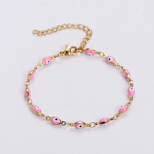 Classic gold link bracelet featuring pink evil eye charms with adjustable lobster clasp